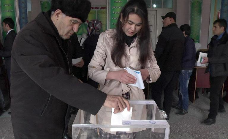 Local residents casting their ballots during a vote in a polling station in Dushanbe on March 1, 2015