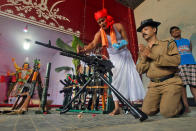 <p>A police officer has weapons blessed by a Hindu priest during the Vishwakarma Puja festival in the outskirts of Agartala, India, Sept. 17, 2016. (Photo: Jayanta Dey/Reuters) </p>