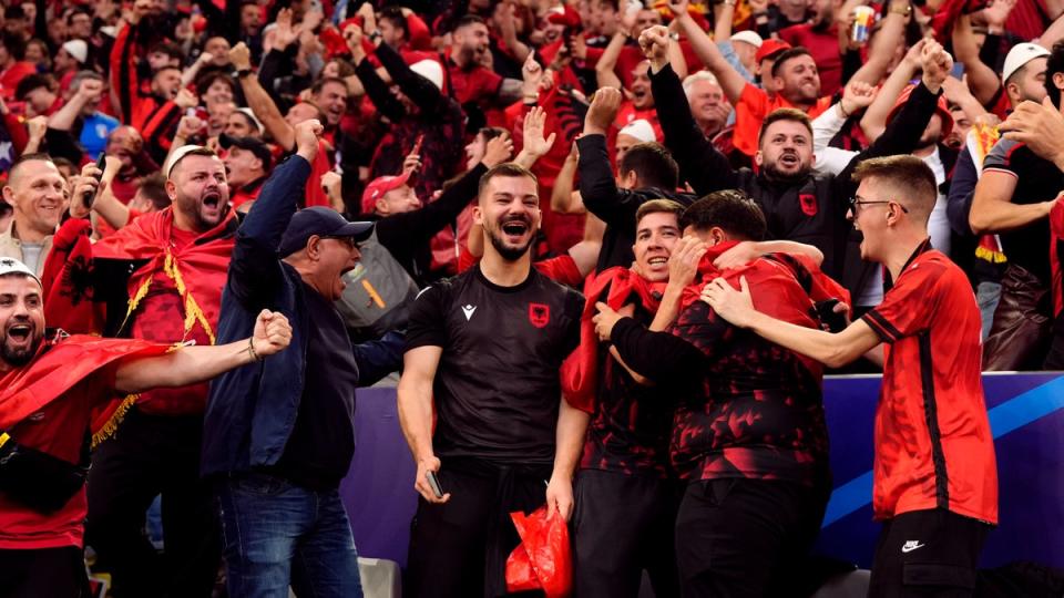 Albanian fans go crazy after their team’s record-breaking goal (PA)