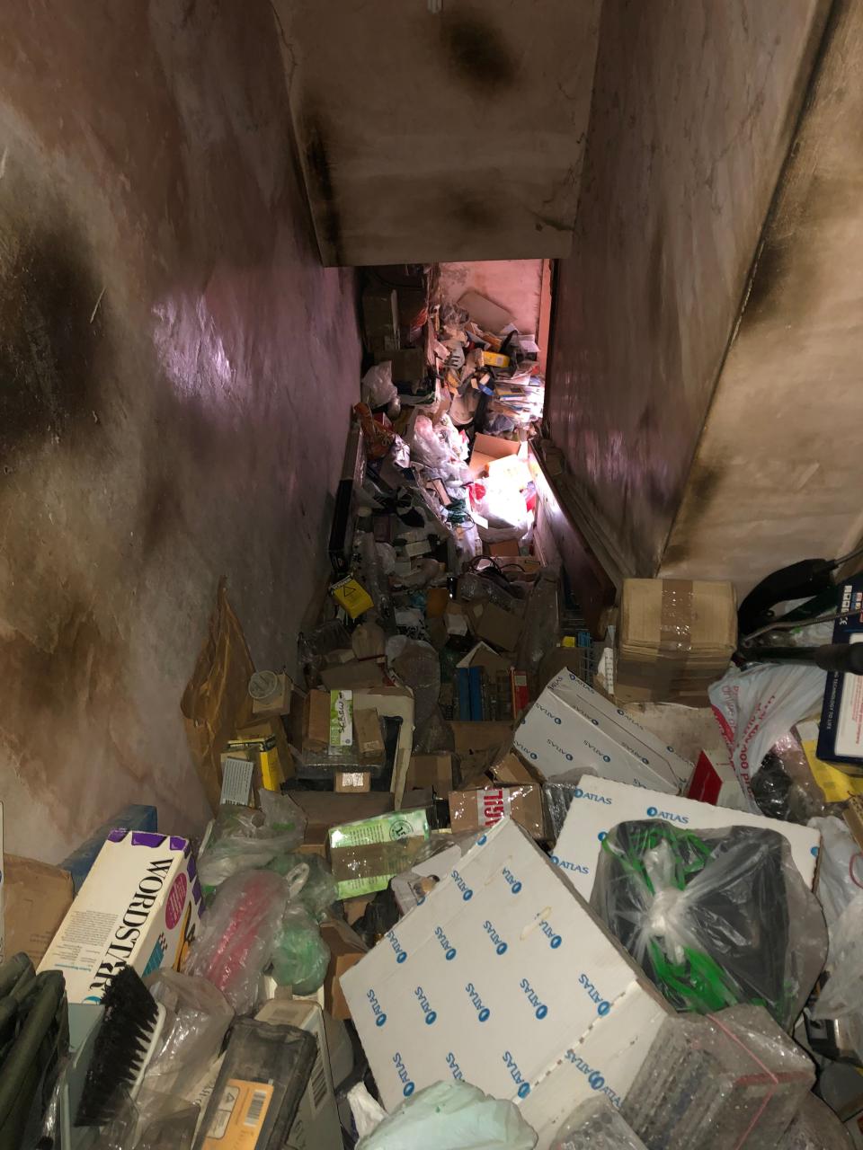 The stairs seen from the top before clearance. There is an after shot of this view

TRIANGLE NEWS 0208 629 3622 // news@trianglenews.co.uk

By Emily Hall

Vid and pics

CLEANERS sent in to tackle a hoarderâ€™s house stuffed to the rafters with junk were horrified when they discovered the bodies of several mummified CATS amid the rubbish.

The case in Lancashire was one of the worst that professional cleaners had ever seen.

They needed a ladder to climb through a second storey window as piles of trash were blocking all other entrances, with teams at first barely able to enter the unkempt property.

*TRIANGLE NEWS DOES NOT CLAIM ANY COPYRIGHT OR LICENCE IN THE ATTACHED MATERIAL. ANY DOWNLOADING FEES CHARGED BY TRIANGLE NEWS ARE FOR TRIANGLE NEWS SERVICES ONLY, AND DO NOT, NOR ARE THEY INTENDED TO, CONVEY TO THE USER ANY COPYRIGHT OR LICENSE IN THE MATERIAL. BY PUBLISHING THIS MATERIAL , THE USER EXPRESSLY AGREES TO INDEMNIFY AND TO HOLD TRIANGLE NEWS HARMLESS FROM ANY CLAIMS, DEMANDS, OR CAUSES OF ACTION ARISING OUT OF OR CONNECTED IN ANY WAY WITH USER'S PUBLICATION OF THE MATERIAL*

