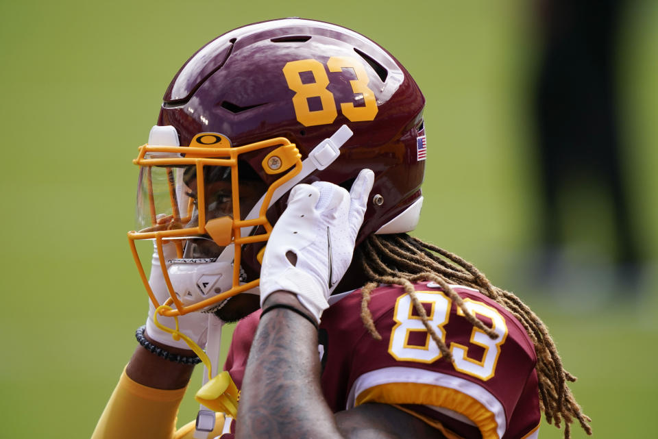 FILE - In this Sept. 13, 2020, file photo, Washington Football Team wide receiver Isaiah Wright adjusts his helmet before the team's NFL football game against Philadelphia Eagles in Landover, Md. (AP Photo/Alex Brandon, File)