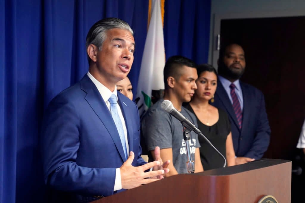 California Attorney General Rob Bonta, left, discusses the rise in hate crimes in California on Tuesday, June 28, 2022 at a news conference in Sacramento, Calif. (AP Photo/Rich Pedroncelli)