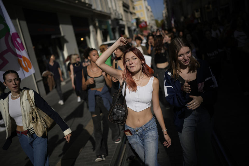 Protesters march during a demonstration, Tuesday, Oct. 18, 2022 in Marseille, southern France. France is in the grip of transport strikes and protests for salary raise on Tuesday that threaten to dovetail with days of wage strikes that have already hobbled fuel refineries and depots, sparking chronic gasoline shortages around the country. (AP Photo/Daniel Cole)