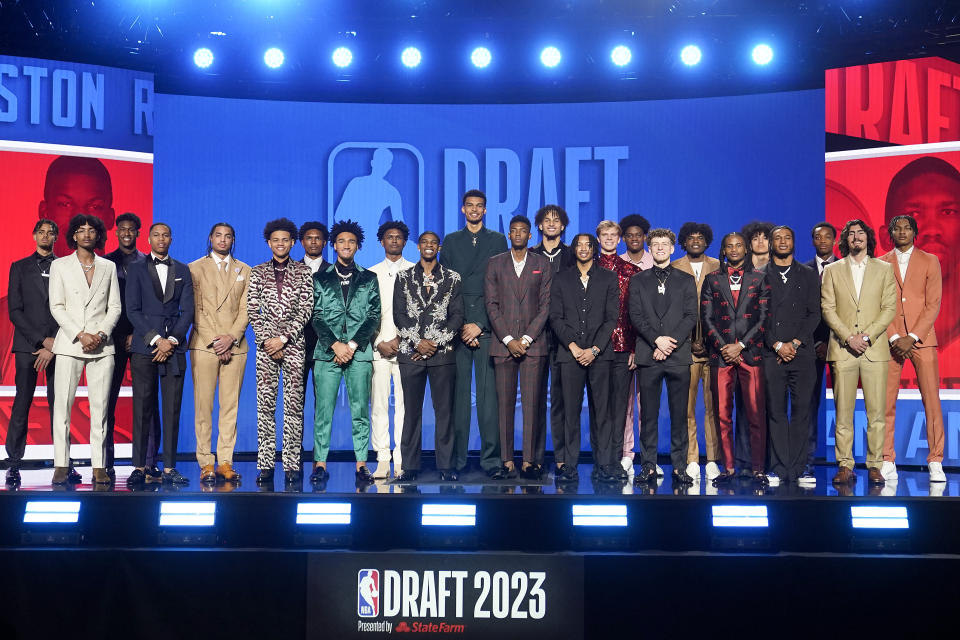 Potential first-round draft picks stand together for a photo at Barclays Center before the NBA basketball draft Thursday, June 22, 2023, in New York. (AP Photo/John Minchillo)
