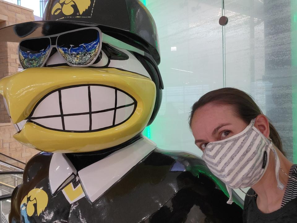 A vaccinated and masked Keri Althoff in the Cedar Rapids, Iowa airport. Althoff flew to Iowa from Baltimore to help her parents move over Labor Day weekend, the only time she has been on a plane since March 2020.