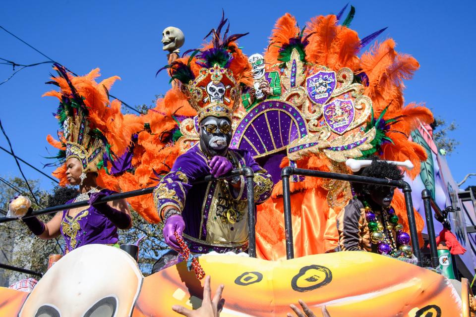 The Krewe of Zulu, New Orleans' oldest Black Carnival krewe, parades during Mardi Gras on Tuesday, March 1, 2022, in New Orleans. Most Zulu riders wear blackface, though it is increasingly controversial. (Photo by Amy Harris/Invision/AP)