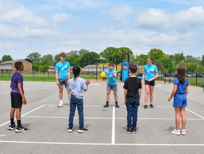 Members of Ross High School’s Link/Interact Club play foursquare with students at Atkinson Elementary School.