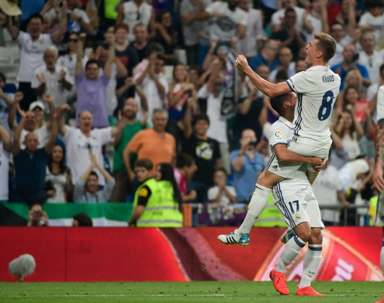 Real Madrid's German midfielder Toni Kroos celebrates after scoring during the Spanish league football match Real Madrid CF vs RC Celta de Vigo at the Santiago Bernabeu stadium in Madrid on August 27, 2016