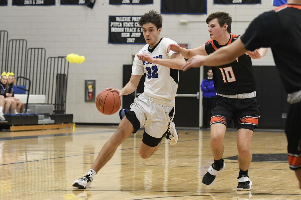 With Pennsbury's Connor Taddei defending, Central Bucks South's Tyler Meinel drives down the court on Tuesday, January 18, 2022. CB South defeated Pennsbury, 62-55.