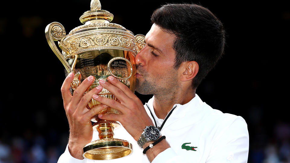 Novak Djokovic, pictured here after winning Wimbledon in 2019.