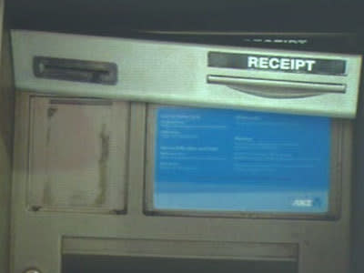 <p>The alleged card skimmer as it is pulled away from the ATM.</p>