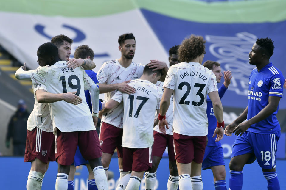 Arsenal players celebrate at the end of the English Premier League soccer match between Leicester City and Arsenal at the King Power Stadium in Leicester, England, Sunday, Feb. 28, 2021. (AP Photo/Rui Vieira, Pool)