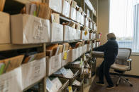 Election worker Mary Pluszczynsky organizes absentee ballots ahead of Tuesday's general election at the city clerk office in Warren, Mich., Wednesday, Oct. 28, 2020. (AP Photo/David Goldman)