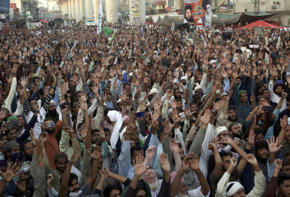 Supporters of Tehreek-e-Labaik Pakistan, a radical Islamist political party, chant religious slogans during a sit-in protest demanding release of their leader, in Lahore, Pakistan, Thursday, Oct. 21, 2021. Thousands of Islamists are protesting in the eastern city of Lahore, demanding the release of their leader Saad Rizvi, who was arrested in April amid protest against France over depictions of Islam's Prophet Muhammad. (AP Photo/K.M. Chaudary)