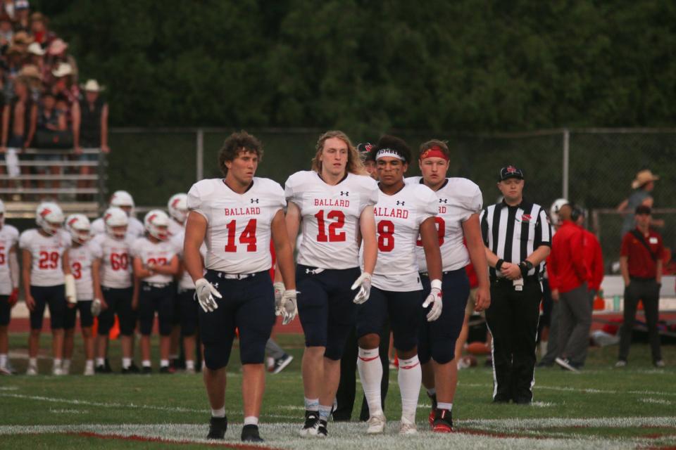 Ballard's Gabe Christensen (left), Eli Rouse (middle) and Jayden Swain (8) were named to the 3A District 2 first team along with teammate Brody Sampson during the 2022 football season.