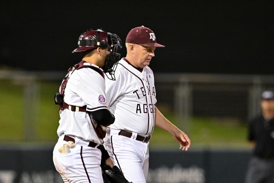 Jun 10, 2022; College Station, TX, USA; Texas A&M head coach Jim Schlossnagle walk out for a mound visit during the top of the sixth inning during the super regional game. Maria Lysaker/USA Today