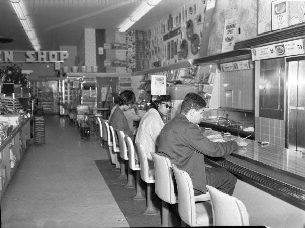 Patricia Stephens Due (in sunglasses), sits next to Charles K. Steele Jr., in this photo taken Feb. 13, 1960, at sit-in at Woolworth's lunch counter in Tallahassee.