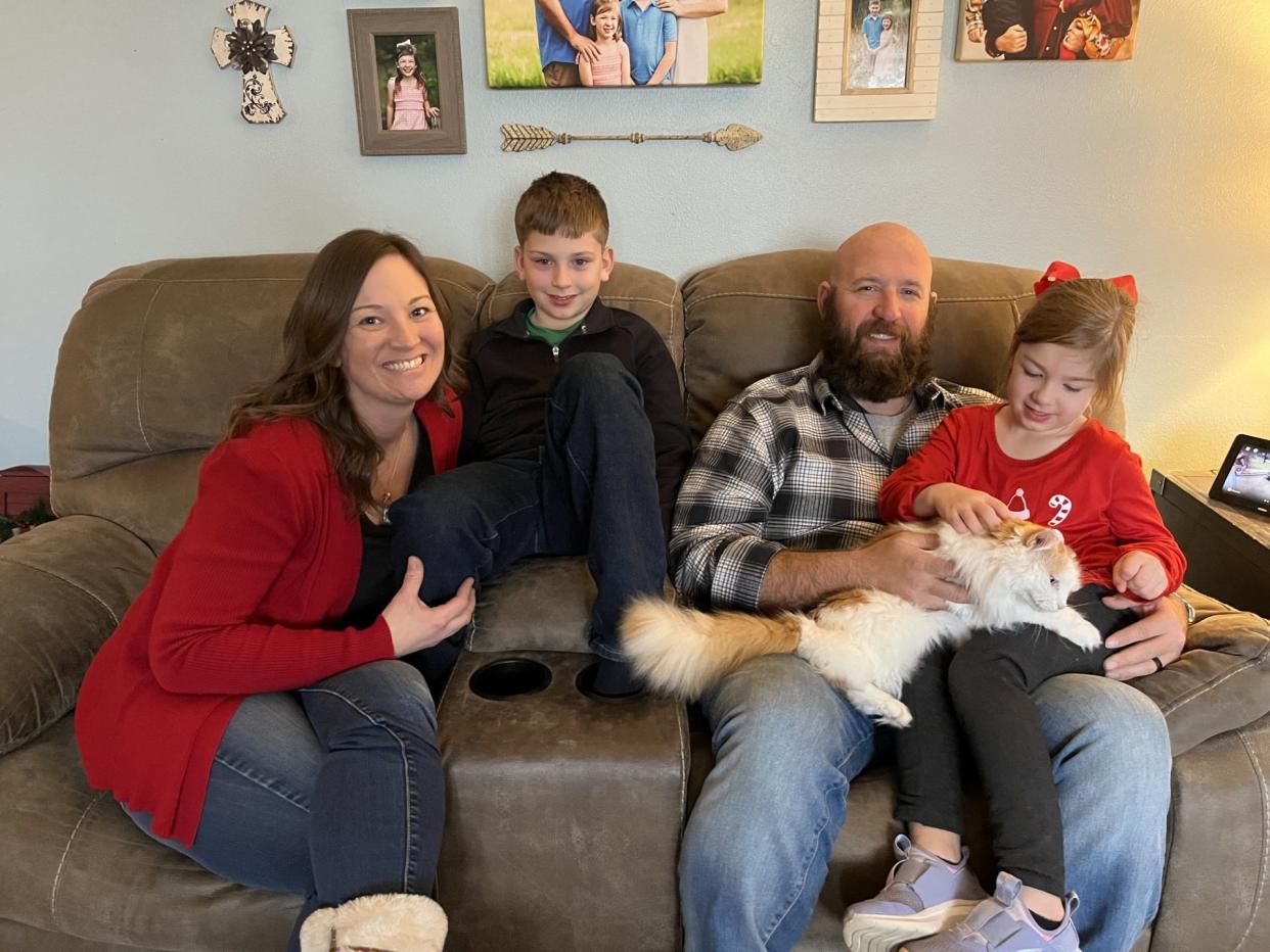 Now five years-old, Harleigh Berry, right, was just three-weeks old when she had emergency surgery to repair a pair of aneurysms in her brain. Pictured at the family's Peoria home are, from left, Ashleigh, Patrick III, Patrick II, and Harleigh.