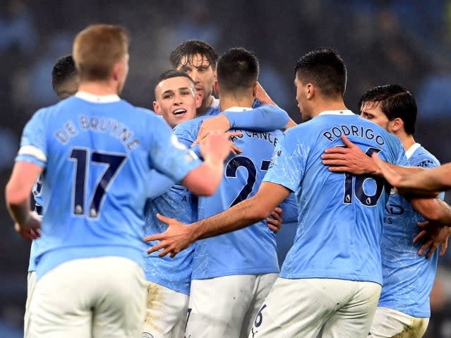 Manchester City celebrate scoring a goal (PA)