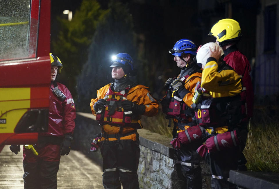 Emergency services work on River Street in Stonehaven, Scotland, Thursday, Oct. 19, 2023. Hundreds of people are being evacuated from their homes and schools have closed in parts of Scotland, as much of northern Europe braces for stormy weather, heavy rain and gale-force winds from the east. The U.K.’s weather forecaster, the Met Office, issued a rare red alert, the highest level of weather warning, for parts of Scotland. (Andrew Milligan/PA via AP)