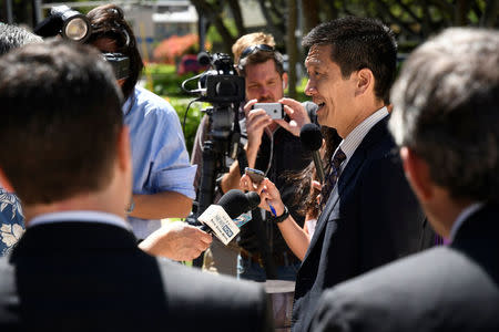Hawaii Attorney General Douglas Chin talks to the media at the U.S. District Court Ninth Circuit after seeking an extension after filing an amended lawsuit against President Donald Trump's new travel ban in Honolulu. REUTERS/Hugh Gentry
