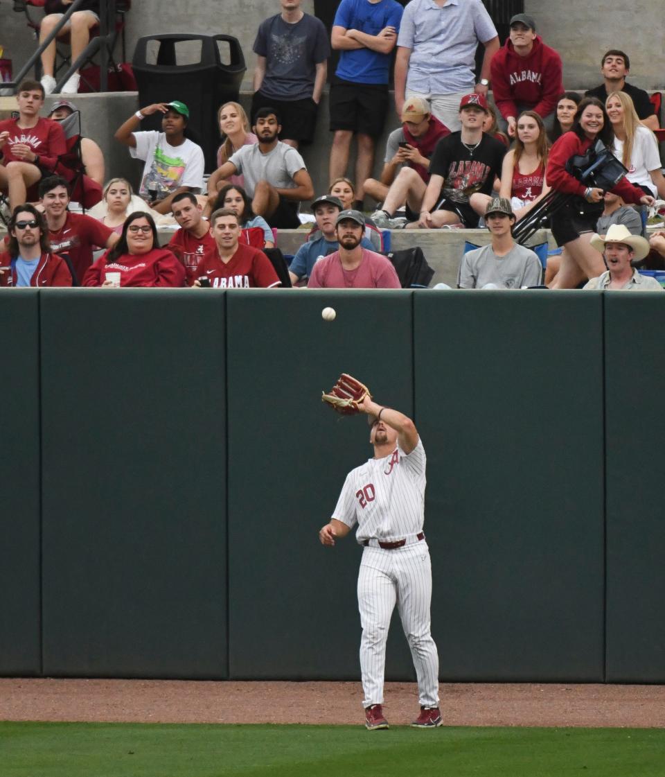 Alabama outfielder Tommy Seidl (20) snags a fly ball on the warning track as the Crimson Tide and the Auburn Tigers faced off in game two of the weekend series Saturday at Sewell-Thomas Stadium. 