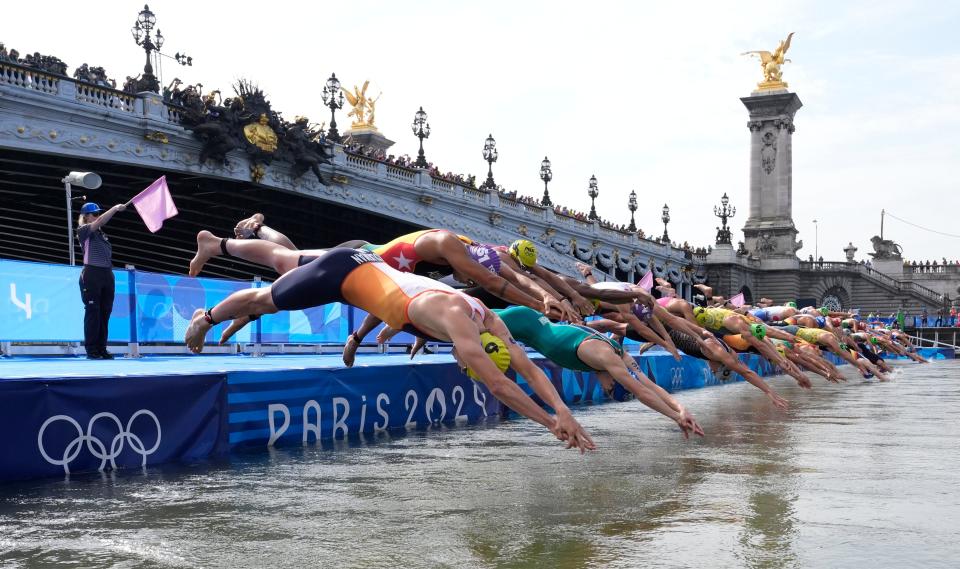 5 photos of Olympic triathletes swimming in the yucky Seine River