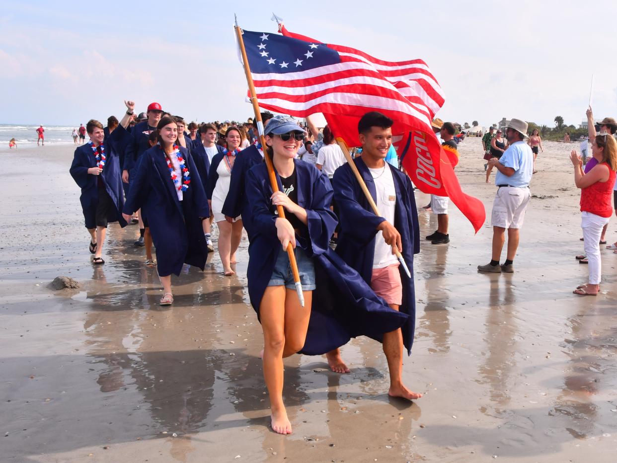 In 2020, the COVID-19 pandemic cancelled graduations across the country. In Florida, Cocoa Beach Junior/Senior High School came up with an alternative: a beach walk in their caps and gowns ... six feet apart. The event was so popular, it is now a tradition the day before their actual graduation.
