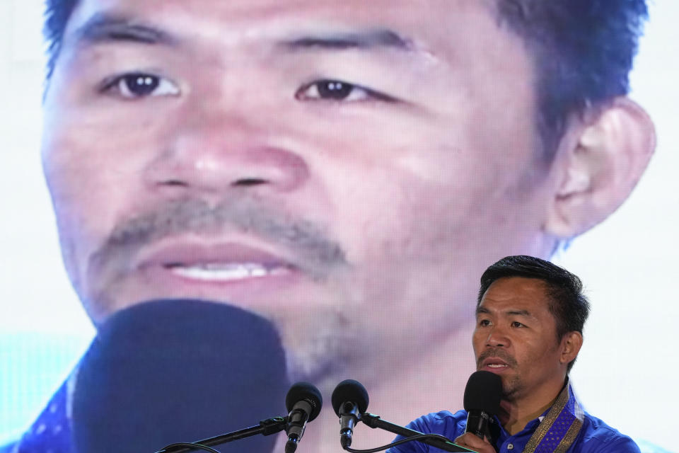 Boxing legend and presidential candidate, senator Manny "Pacman" Pacquiao speaks to the crowd in Pasay city, Philippines on March 14, 2022. The winner of May 9, Monday's vote will inherit a sagging economy, poverty and deep divisions, as well as calls to prosecute outgoing leader Rodrigo Duterte for thousands of deaths as part of a crackdown on illegal drugs. (AP Photo/Aaron Favila)
