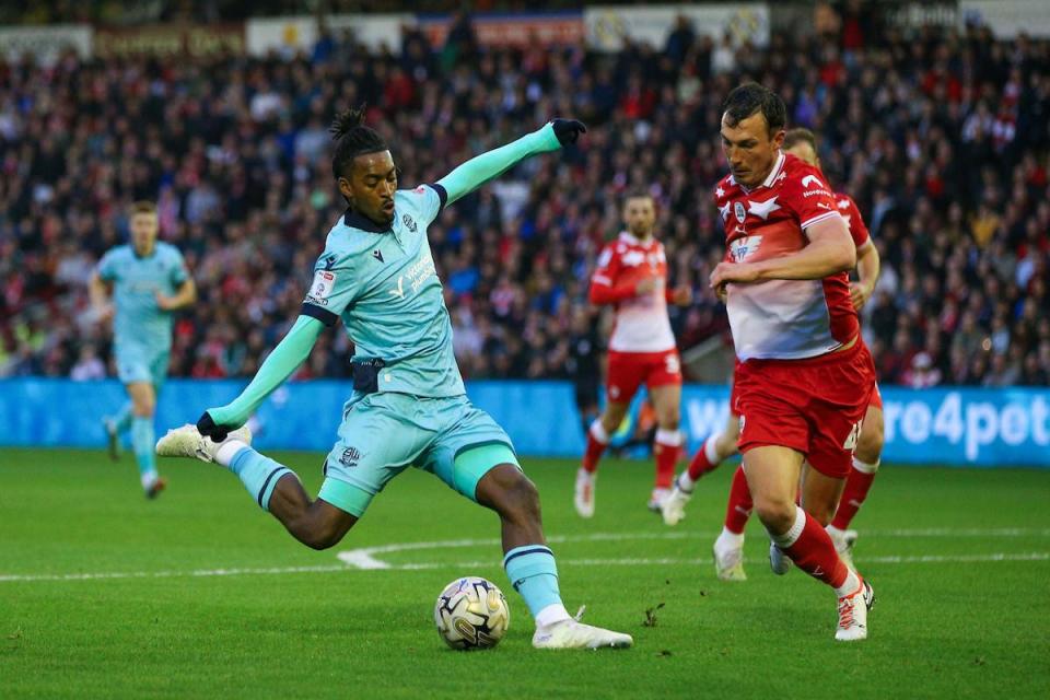 Paris Maghoma in action against Barnsley's Josh Earl on Friday night <i>(Image: Camerasport)</i>