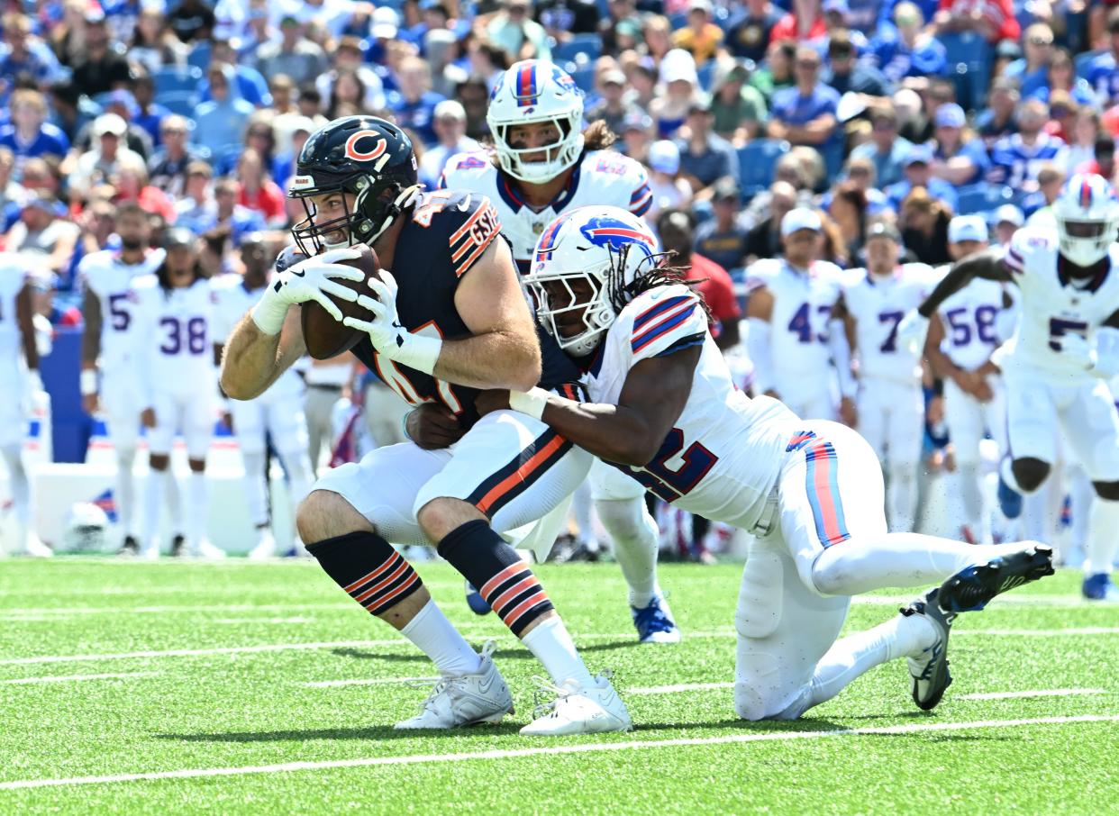 Chicago Bears tight end Tommy Sweeney is tackled by Buffalo Bills linebacker Dorian Williams in the second quarter of a pre-season game at Highmark Stadium.