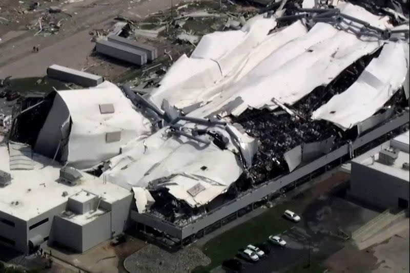 FILE PHOTO: The roof of a Pfizer facility shows heavy damage after a tornado passed the area in Rocky Mount