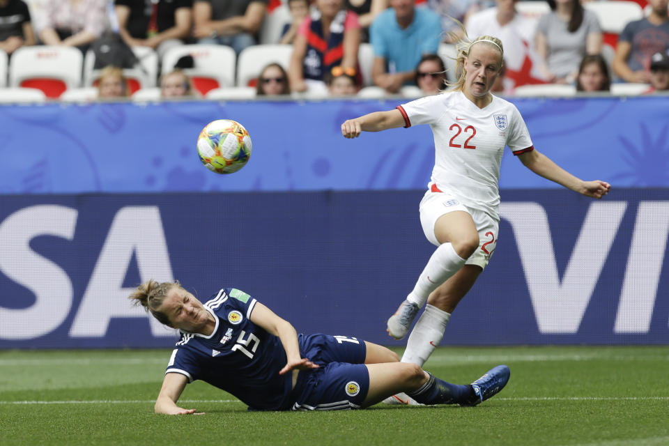 Scotland's Sophie Howard, left, and England's Beth Mead compete for the ball during the Women's World Cup Group D soccer match between England and Scotland in Nice, France, Sunday, June 9, 2019. (AP Photo/Claude Paris)