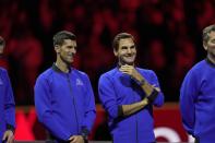 Team Europe's Novak Djokovic and Roger Federer stand side by side at the end of the Laver Cup tennis tournament in London, Sunday, Sept. 25, 2022. (AP Photo/Kin Cheung)