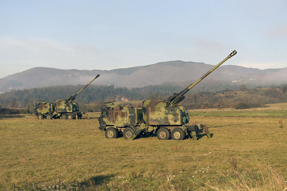 In this photo provided by the Serbian Defense Ministry Press Service, Serbian army self-propelled 155 mm gun-howitzers are seen on position near administrative line with Kosovo, south Serbia, Monday, Dec. 26, 2022. Kosovo remains a potential flashpoint in the Balkans years after the 1998-99 war that ended with NATO intervention. Serbia doesn't recognize the 2008 declaration of independence of its former province, while Western efforts to mediate a solution so far have failed. (Serbian Defense Ministry Press Service via AP)