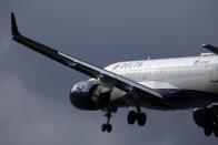 FILE - A Delta Air Lines plane lands at Logan International Airport, Jan. 26, 2023, in Boston. On Thursday, July 11, 2024, Delta Air Lines said its second-quarter profit is down 29% from a year earlier, and it's giving a disappointing outlook for the third quarter. (AP Photo/Michael Dwyer)