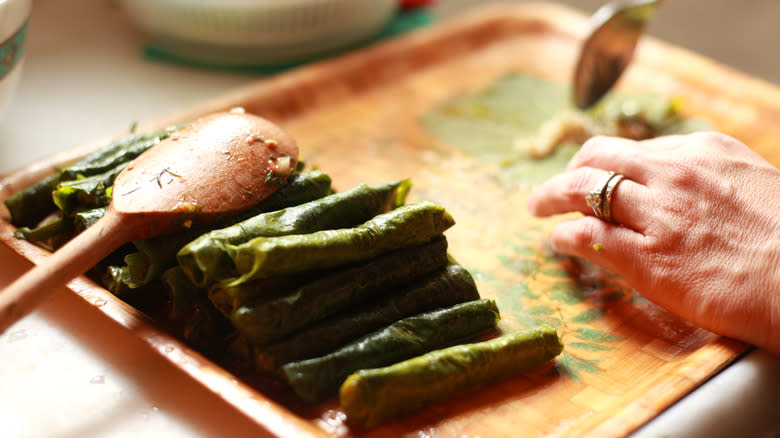 hand making stuffed leaves