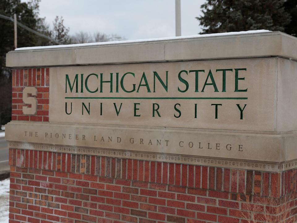 A sign for Michigan State University is seen near the campus in East Lansing.JPG