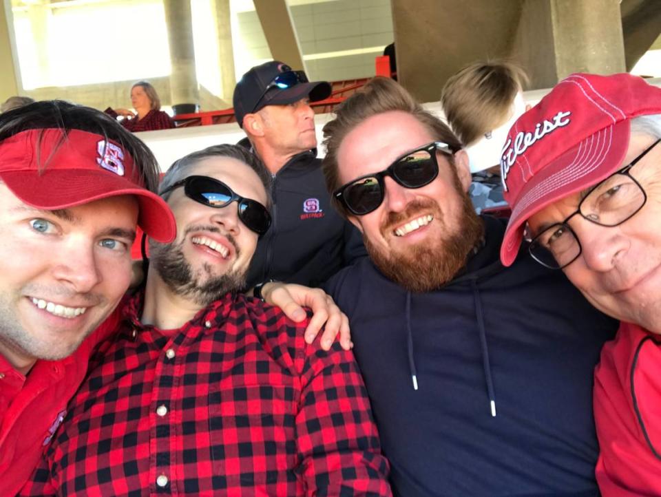 Andrew Carter (second from right) with his dad (right) and two of his brothers at a 2019 N.C. State football game.