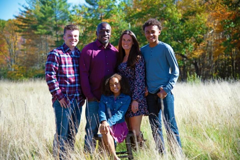 Former University of New Hampshire football standout Stephan Lewis stands with his wife Brianne, and their three children, Gavyn 22; Amari, 14; and Natalia, 10. The Lewis family lives in Nottingham.