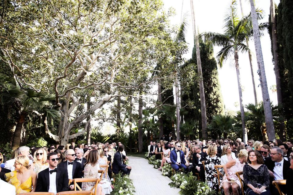 The bride wore Oscar de la Renta, inspired by her grandmother, for her greenery-filled ceremony at the Beverly Hills Hotel.