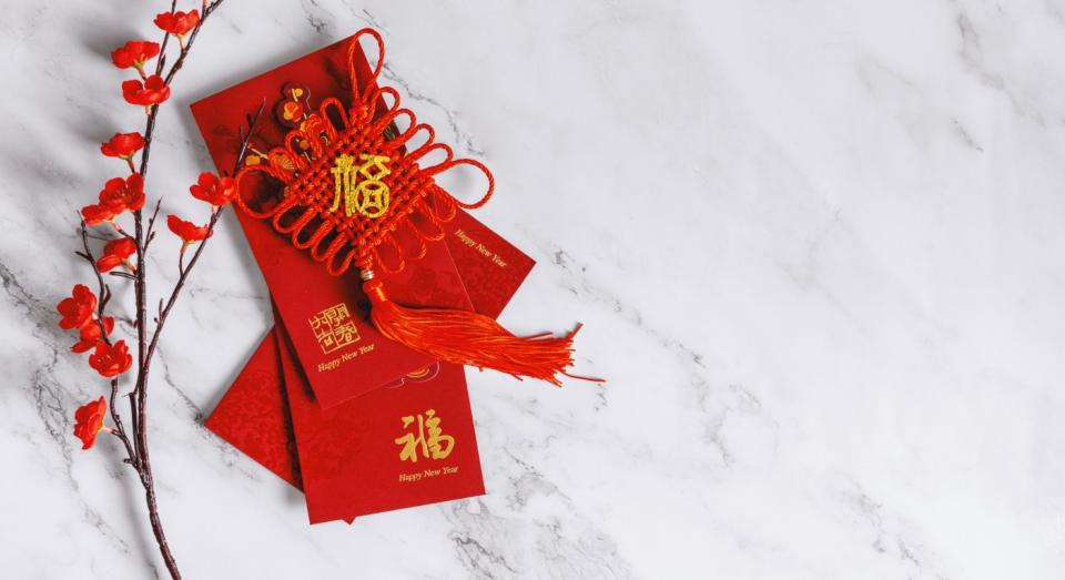 Red envelopes containing money are often given as gifts to children (Getty)