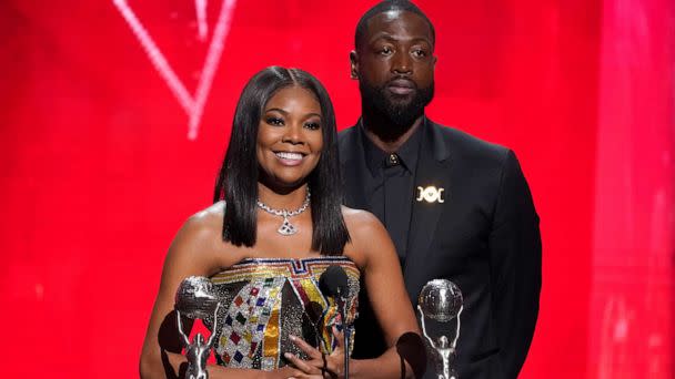PHOTO: Gabrielle Union-Wade, left, and Dwayne Wade accept the president's award at the 54th NAACP Image Awards on Feb. 25, 2023, at the Civic Auditorium in Pasadena, Calif. (Chris Pizzello/Invision/AP)