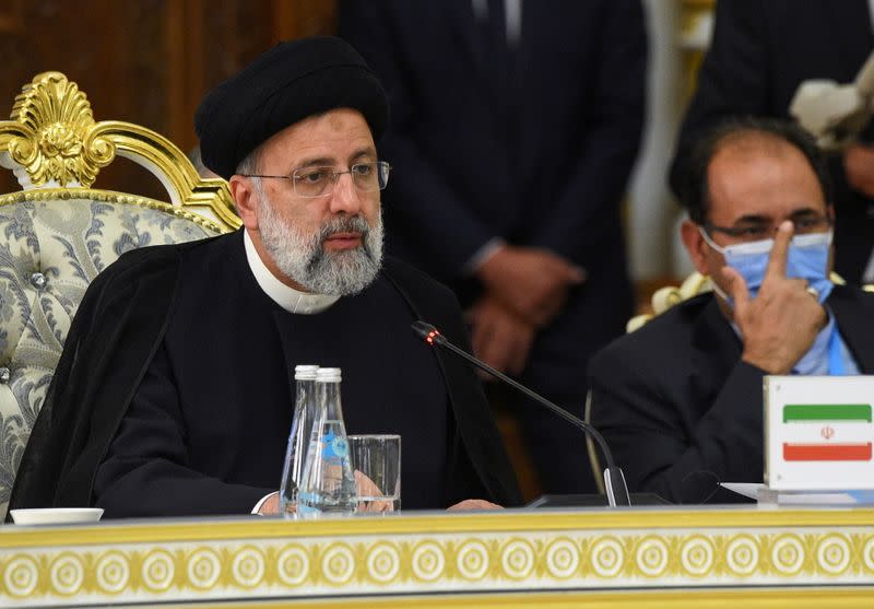 FILE PHOTO: Iranian President Ebrahim Raisi delivers a speech during the Shanghai Cooperation Organization (SCO) summit in Dushanbe, Tajikistan September 17, 2021.