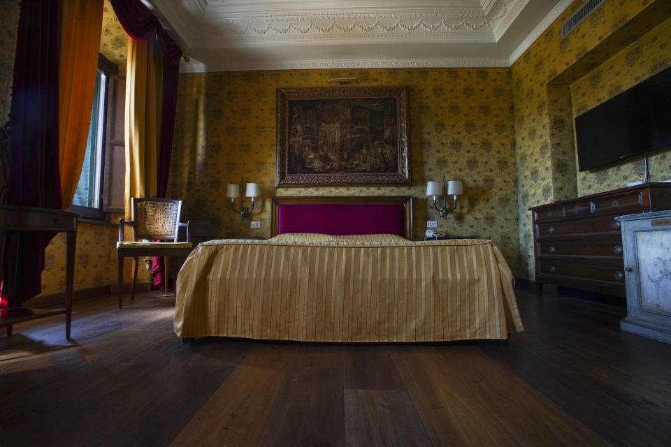 This Monday, May 11, 2020 photo shows a bedroom of the Atlante Star Hotel, in Rome. The hotel remained open during the lockdown measures due to COVID-19, but has very few if no guests at all. (AP Photo/Andrew Medichini)