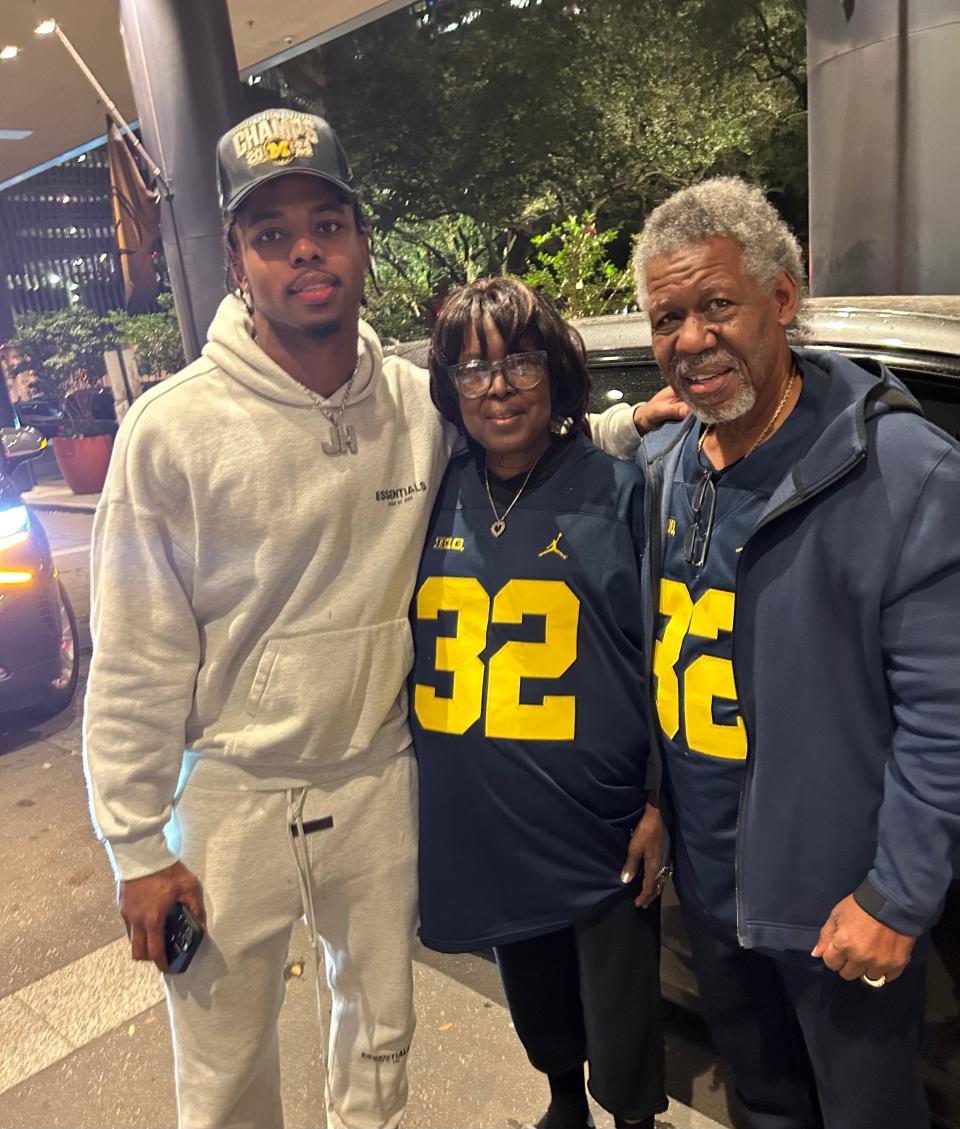 Michigan defensive end Jaylen Harrell and his grandparents Florence and Tallie Gainer.