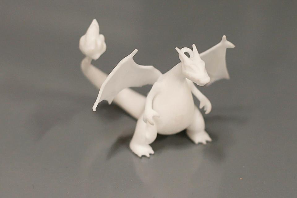 A small dragon 3D printed at the new ProtoXYZ offices at the DeMello International Center on Union Street in New Bedford.