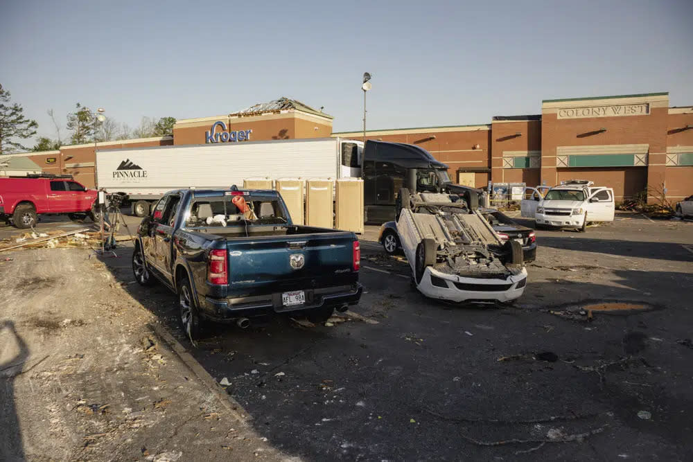 Businesses and vehicles are damaged from a storm in Little Rock, Ark., on Saturday, April 1, 2023. Unrelenting tornadoes that tore through parts of the South and Midwest that shredded homes and shopping centers. (AP Photo/Sha’Cori Washington)