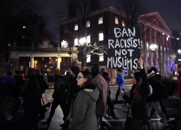 Several hundred people march past the gates of Harvard Yard at Harvard University while protesting the travel ban in Cambridge, Mass., on March 7, 2017. (Photo: Charles Krupa/AP)