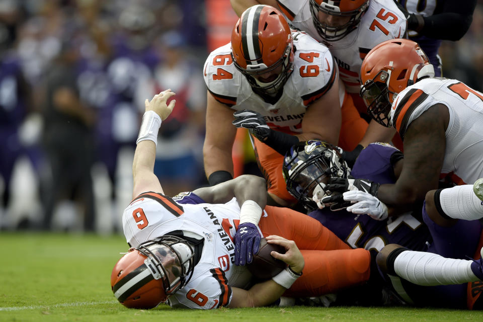 Cleveland Browns quarterback Baker Mayfield (6) is sacked by Baltimore Ravens linebacker Pernell McPhee during the first half of an NFL football game Sunday, Sept. 29, 2019, in Baltimore. (AP Photo/Gail Burton)